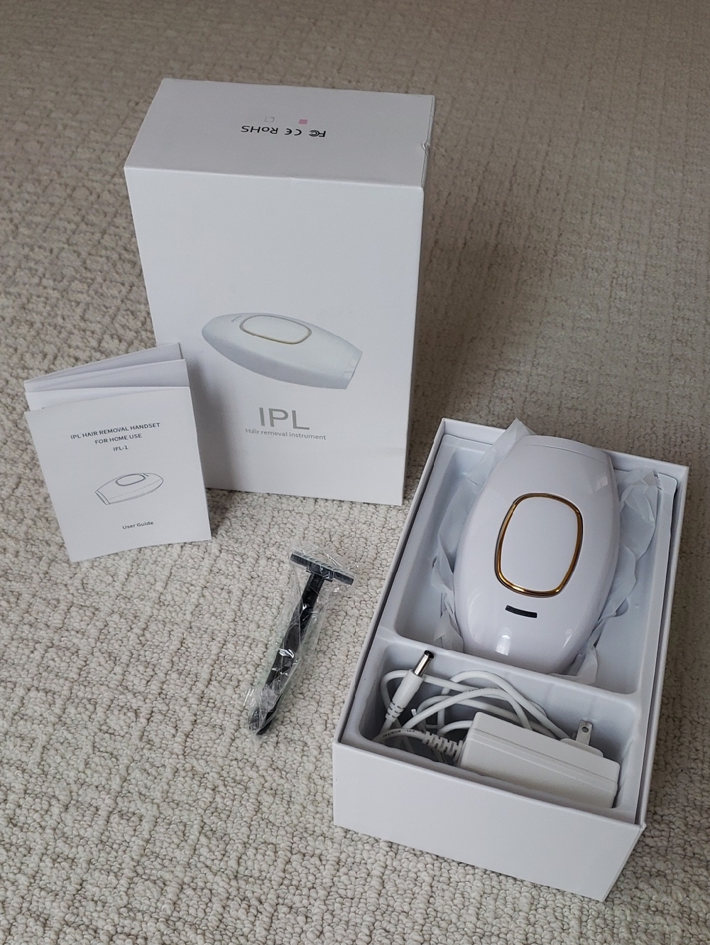White IPL Hair Removal Device with Gold Accent